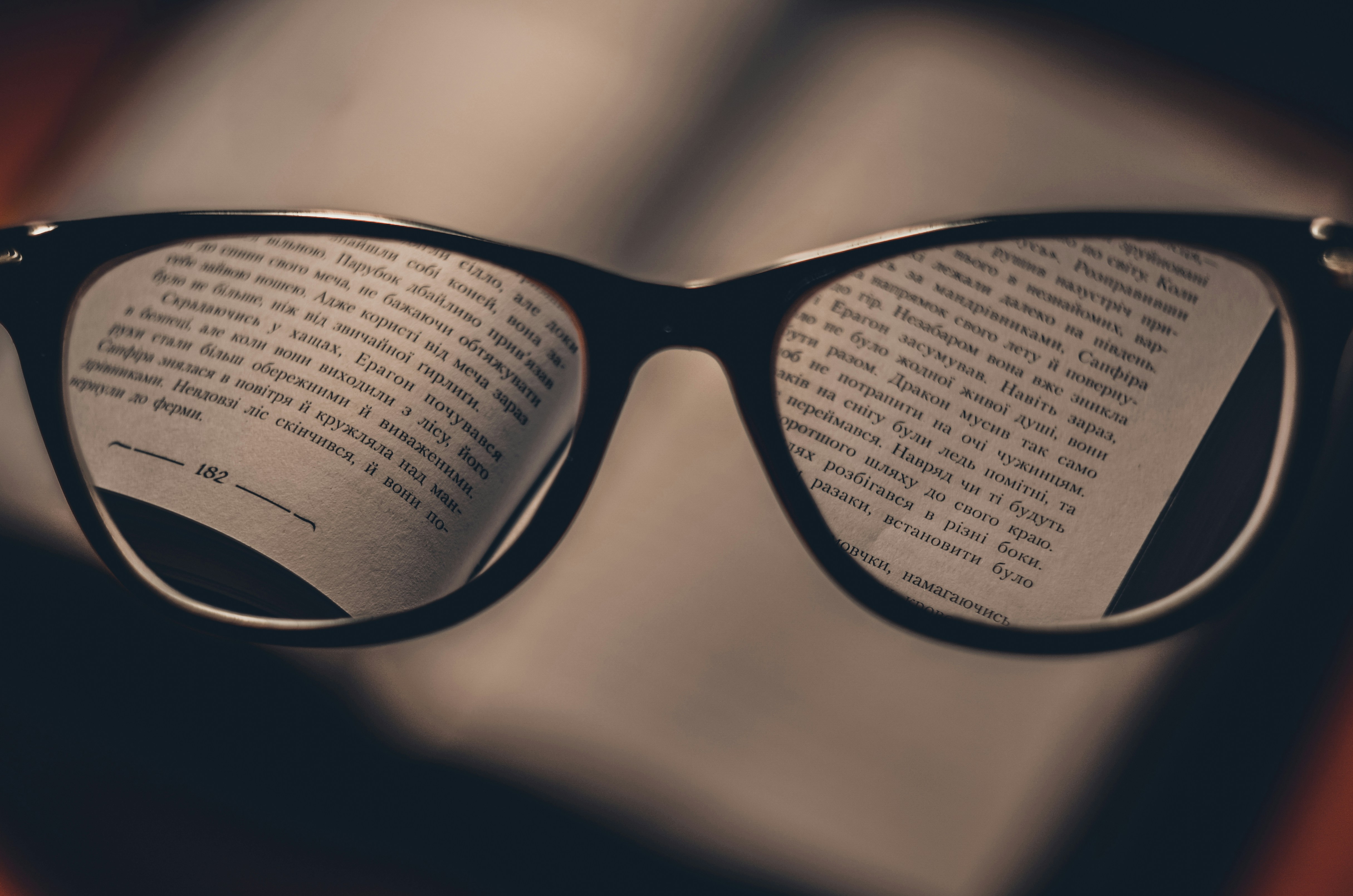 Glasses on top of an open book
